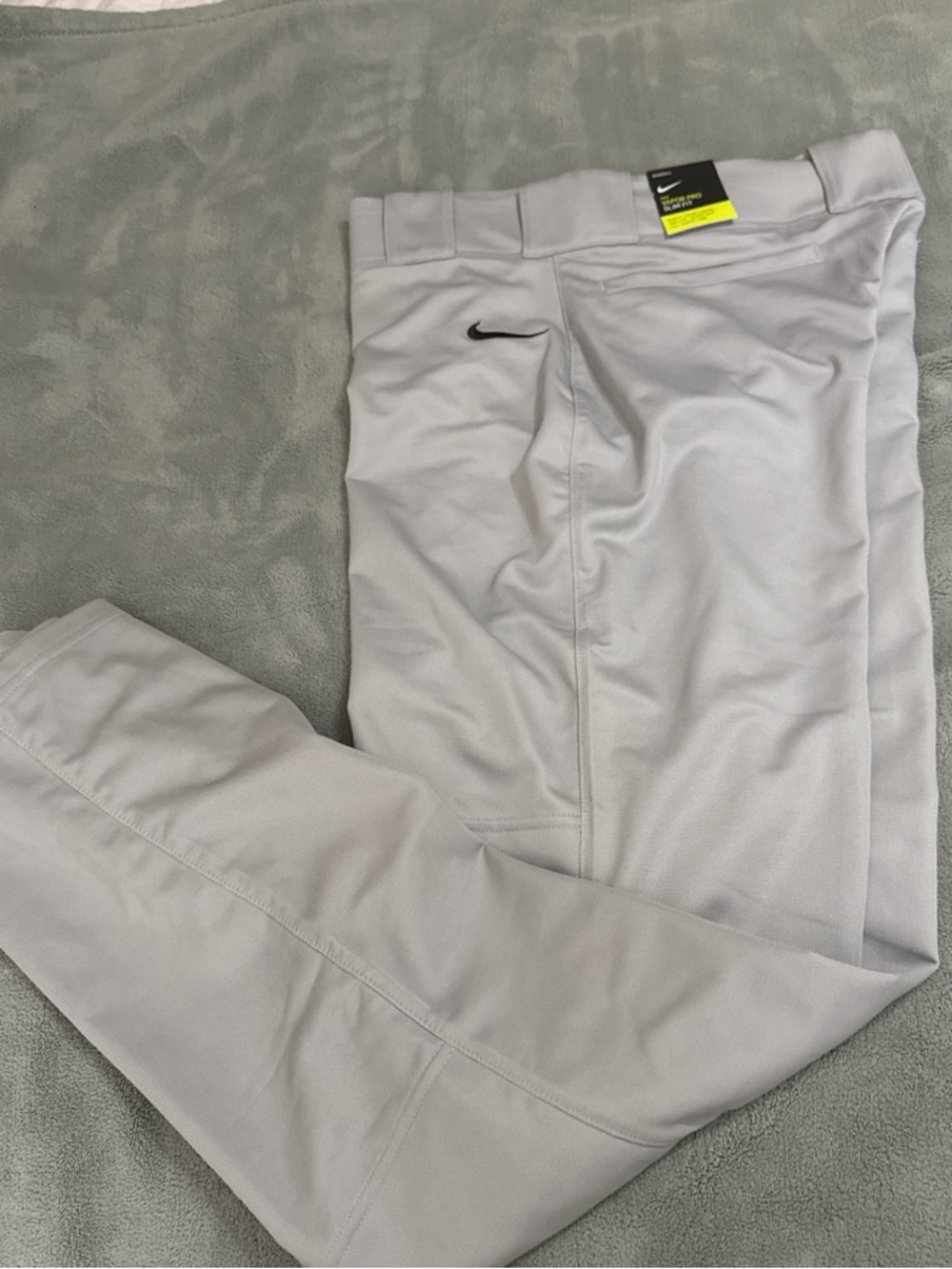 Nike Men’s Light Gray baseball pants with Black Swoosh